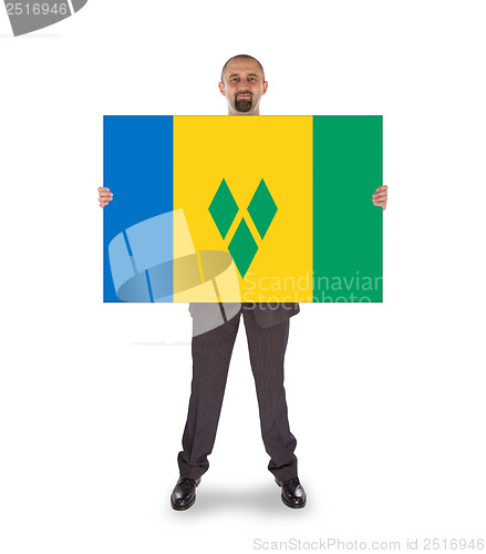 Image of Smiling businessman holding a big card or flag