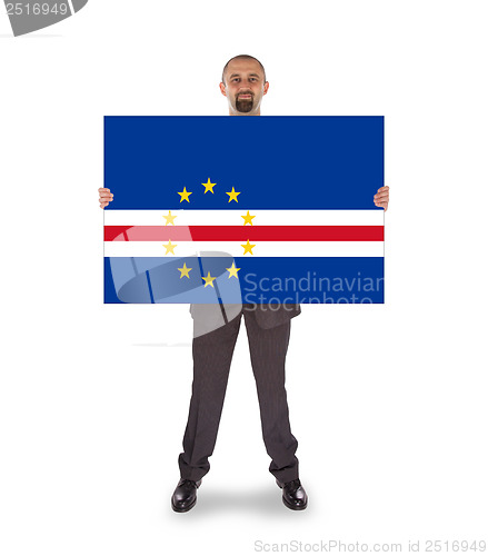 Image of Smiling businessman holding a big card or flag