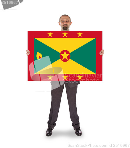 Image of Smiling businessman holding a big card or flag