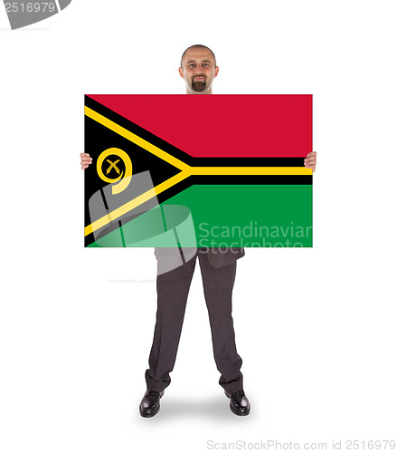 Image of Smiling businessman holding a big card or flag