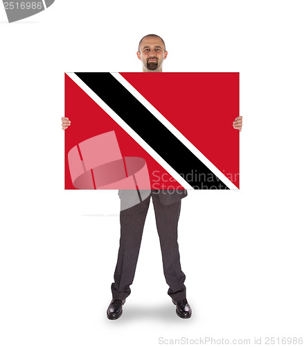 Image of Smiling businessman holding a big card or flag