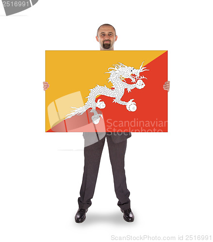 Image of Smiling businessman holding a big card or flag