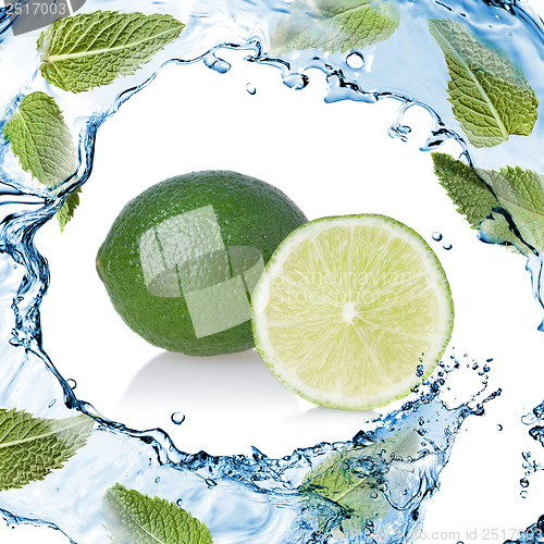 Image of water splash with lime and green mint isolated on white