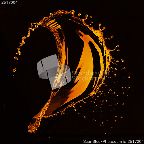 Image of orange water splash isolated on black