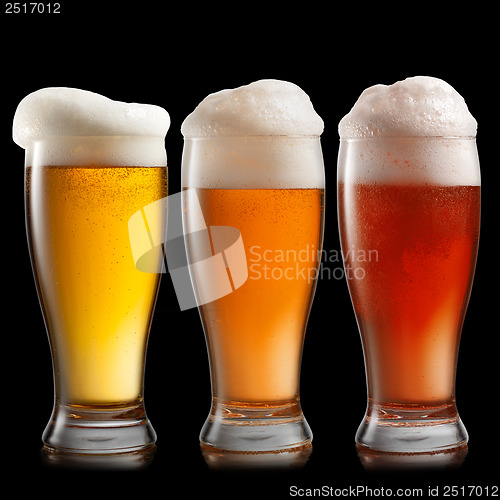 Image of Different beer in glasses isolated on white background
