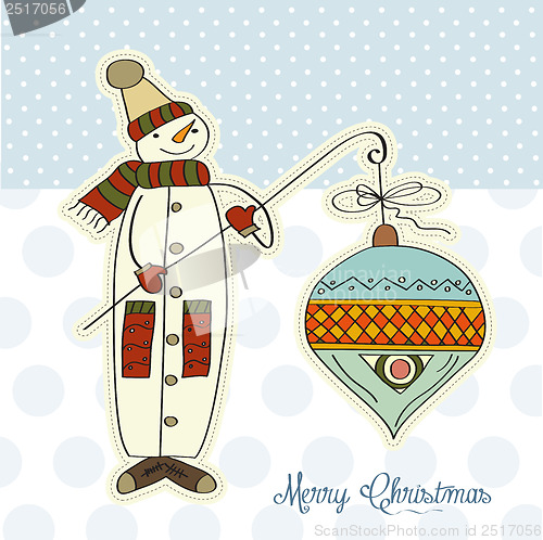 Image of snowman with big Christmas ball