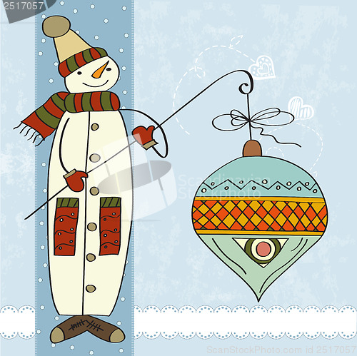 Image of snowman with big Christmas ball