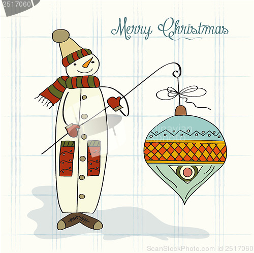 Image of snowman with big Christmas ball