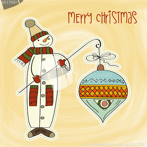 Image of snowman with big Christmas ball