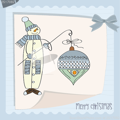 Image of snowman with big Christmas ball