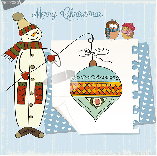 Image of snowman with big Christmas ball
