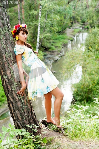 Image of Attractive woman with flower wreath