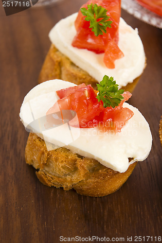 Image of Bruschetta with mozarella and tomatoes