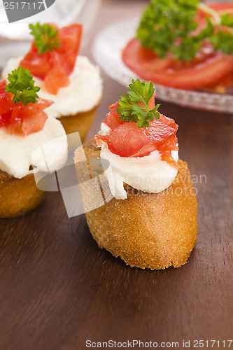Image of Bruschetta with mozarella and tomatoes
