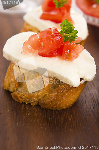 Image of Bruschetta with mozarella and tomatoes