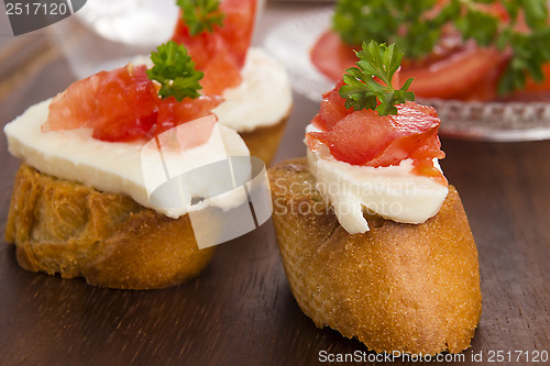 Image of Bruschetta with mozarella and tomatoes