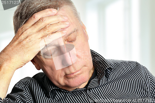 Image of Senior man with a headache