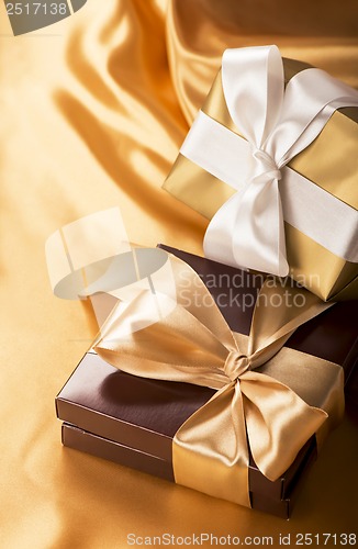 Image of brown box with candies and golden tape