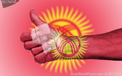Image of Old woman giving the thumbs up sign