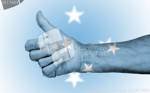 Image of Old woman giving the thumbs up sign