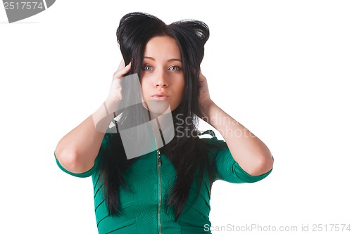Image of Young girl wearing green dress posing in studio