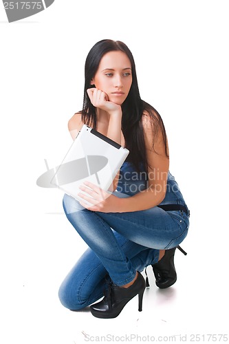 Image of Young girl posing in studio with tablet pc
