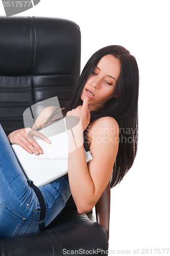 Image of Woman using a touch-pad PC sitting in chair