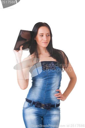 Image of Young girl posing in studio with tablet pc