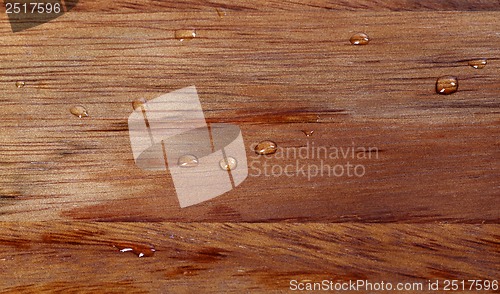 Image of Wooden kitchen board with water drops
