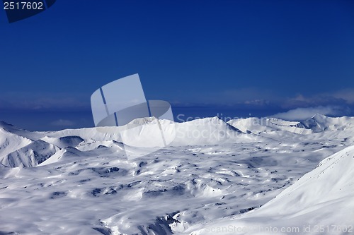 Image of Snowy plateau and off-piste slope at sun day