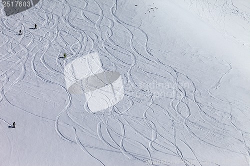 Image of Snowboarders and skiers on off piste slope