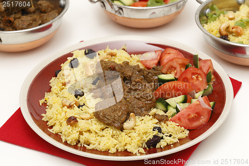 Image of Beef curry with serving bowls