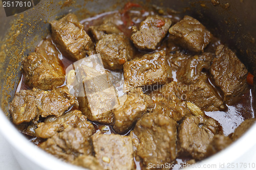 Image of Beef madras curry cooking