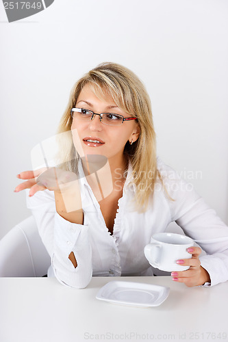 Image of An attractive girl with a cup