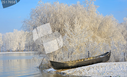 Image of Frosty winter trees and boat