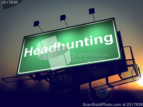 Image of Headhunting - Billboard on the Sunrise Background.