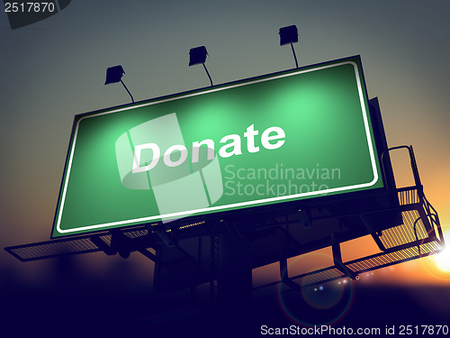 Image of Donate - Billboard on the Sunrise Background.