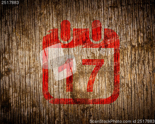 Image of Red Calendar with Date Icon on Wood.