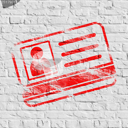 Image of Red ID Card Icon on White Brick Wall.