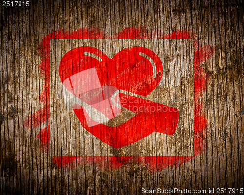 Image of Red Charity Concept Painted by Stencil on Wood.