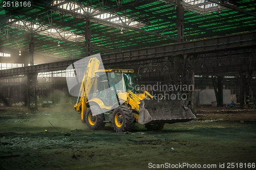 Image of Industrial interior with bulldozer inside