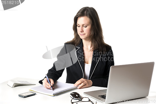 Image of Businesswoman writing something