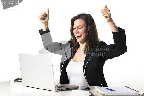 Image of Happy woman in office with thumbs up