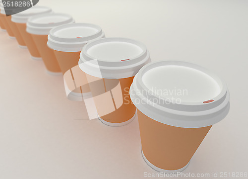 Image of A row of paper coffee cups.