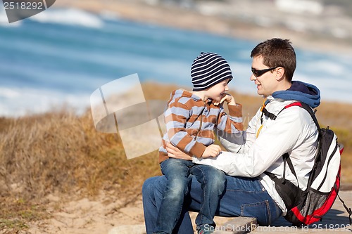 Image of family hiking at the beach