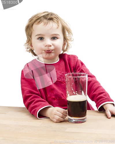 Image of young girl drinking beer