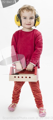 Image of child in red with toolbox and earmuffs