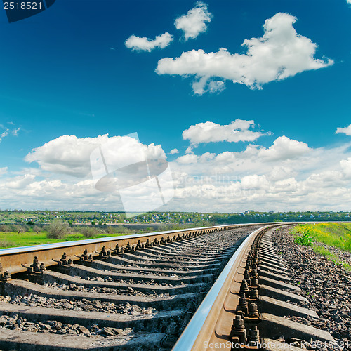 Image of railroad closeup to cloudy horizon