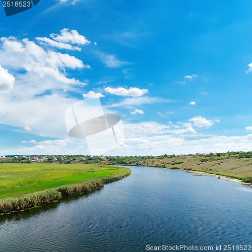 Image of blue river and clouds on sky