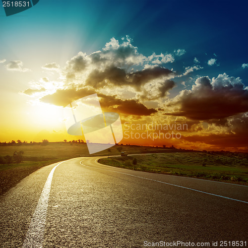 Image of fantastic sunset over asphalt road